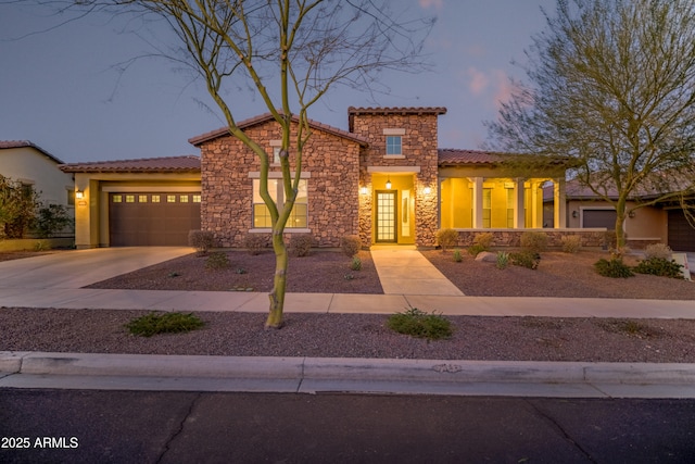 mediterranean / spanish house featuring a garage