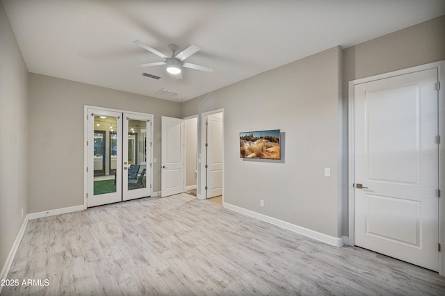 unfurnished bedroom with access to exterior, french doors, light wood-type flooring, and ceiling fan