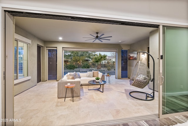 living room with ceiling fan