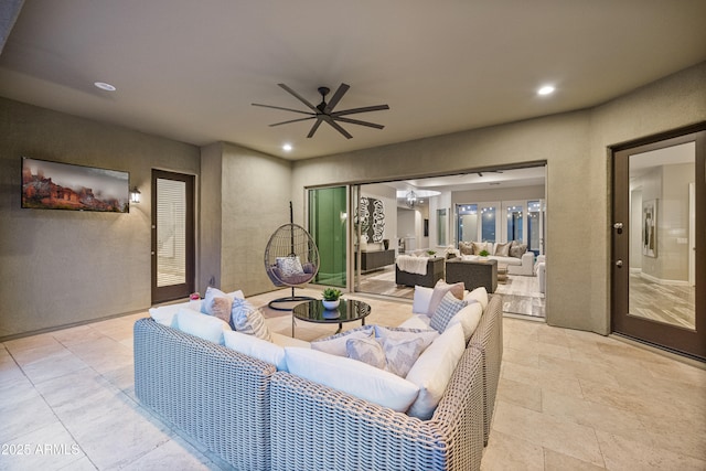 living room with ceiling fan