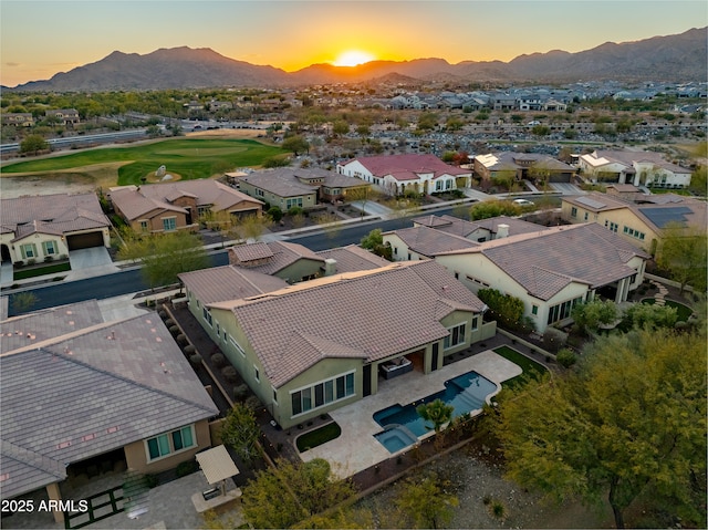 aerial view at dusk with a mountain view