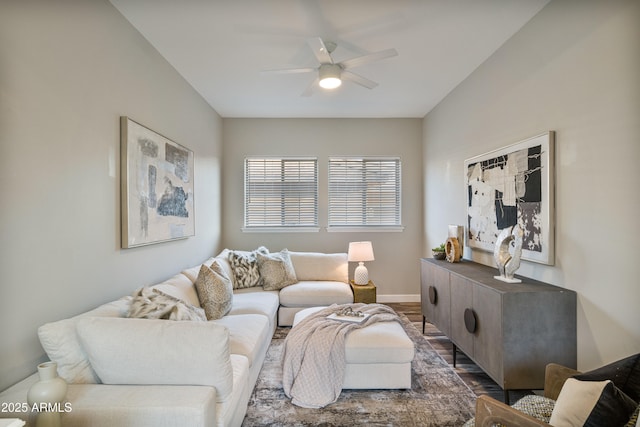 living room featuring dark hardwood / wood-style flooring and ceiling fan