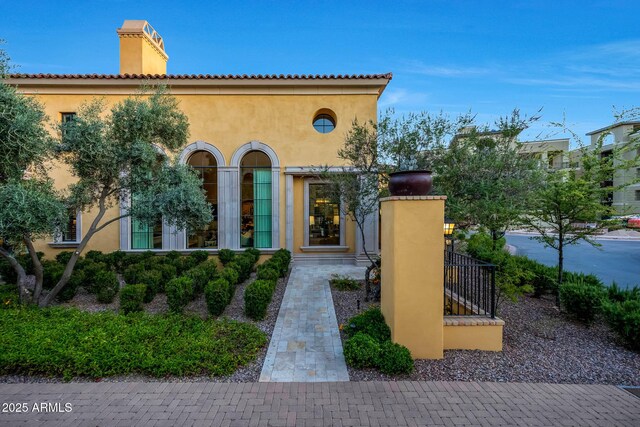18927 N 101st St, Scottsdale, AZ 85255 - mediterranean / spanish home with stucco siding and a chimney