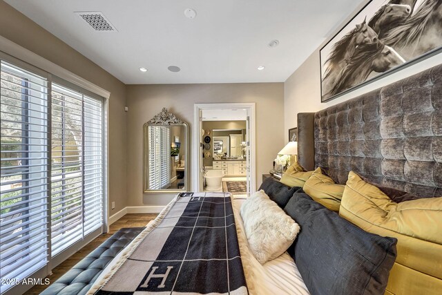 18927 N 101st St, Scottsdale, AZ 85255 - bedroom with wood finished floors, baseboards, ensuite bath, and recessed lighting