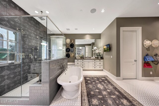18927 N 101st St, Scottsdale, AZ 85255 - bathroom featuring a shower stall, a soaking tub, tile patterned floors, vanity, and baseboards