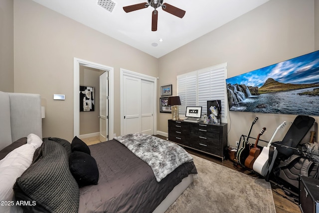 18927 N 101st St, Scottsdale, AZ 85255 - bedroom featuring light wood-style floors, baseboards, ceiling fan, and a closet