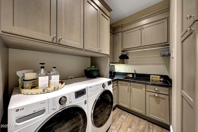 18927 N 101st St, Scottsdale, AZ 85255 - laundry room with cabinet space, independent washer and dryer, and light wood-type flooring