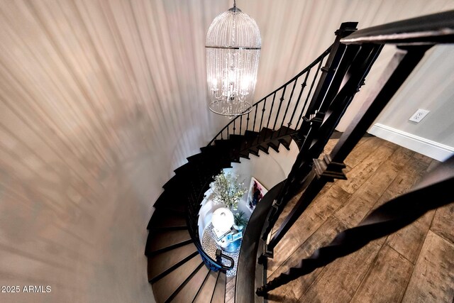 18927 N 101st St, Scottsdale, AZ 85255 - stairway with a chandelier, baseboards, and wood finished floors