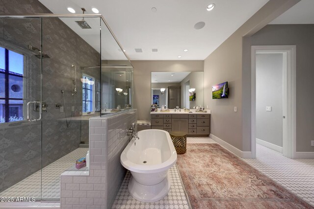 18927 N 101st St, Scottsdale, AZ 85255 - bathroom with a freestanding bath, a stall shower, vanity, tile patterned flooring, and baseboards