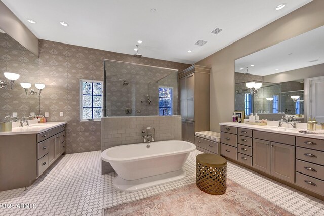 18927 N 101st St, Scottsdale, AZ 85255 - full bathroom featuring a tile shower, two vanities, a chandelier, a freestanding bath, and recessed lighting