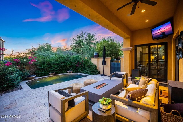18927 N 101st St, Scottsdale, AZ 85255 - patio terrace at dusk with an outdoor living space with a fire pit and ceiling fan