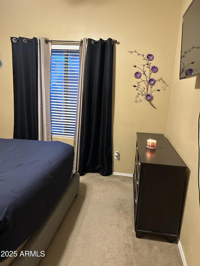 bedroom featuring light carpet