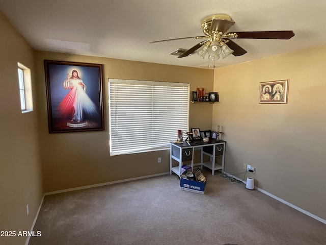 miscellaneous room featuring ceiling fan and carpet flooring