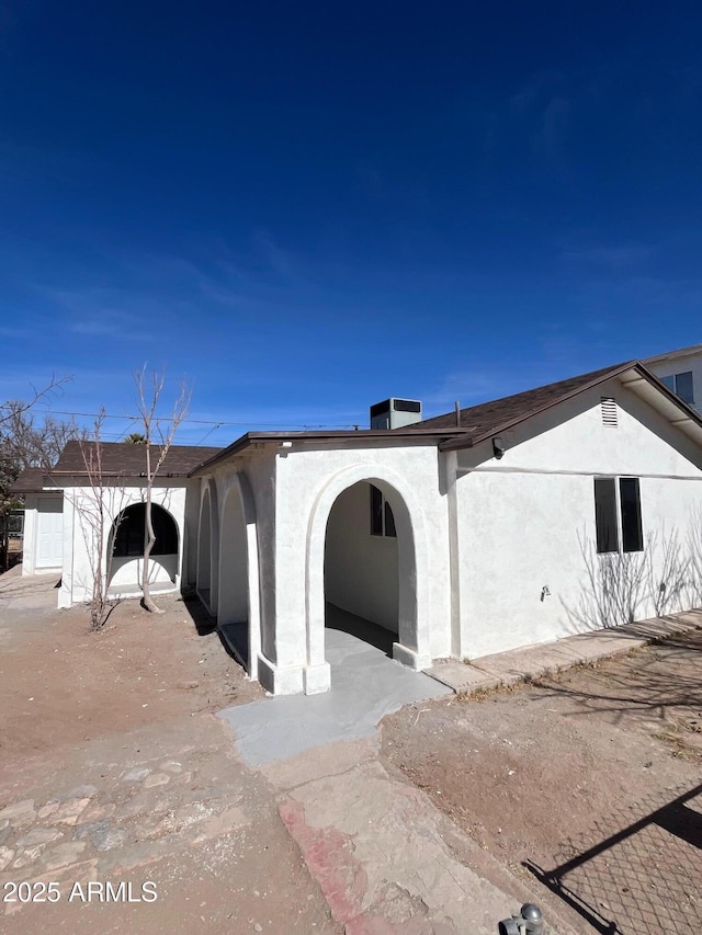 view of front of home with central air condition unit