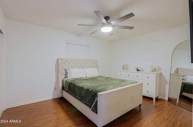 bedroom with ceiling fan and dark wood-type flooring