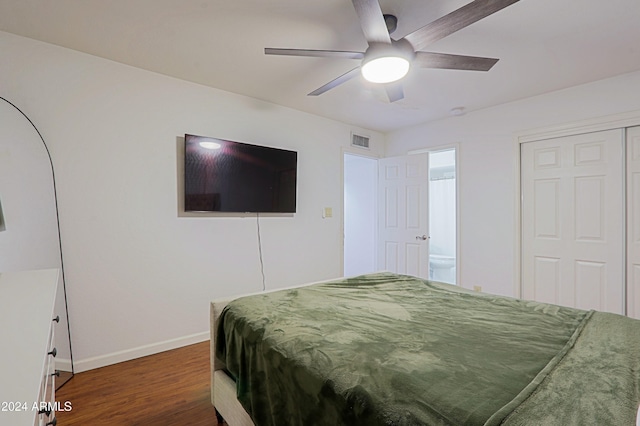 bedroom with ceiling fan, dark hardwood / wood-style flooring, and ensuite bathroom