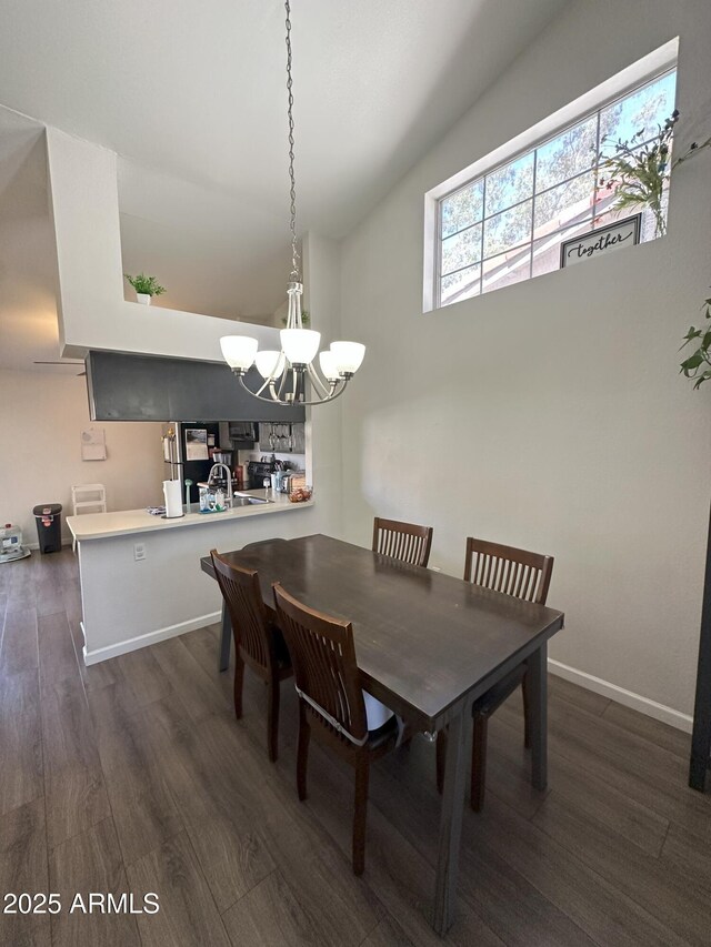 1718 S Longmore St Unit 53, Mesa, AZ 85202 - dining area featuring dark wood-style flooring and a chandelier