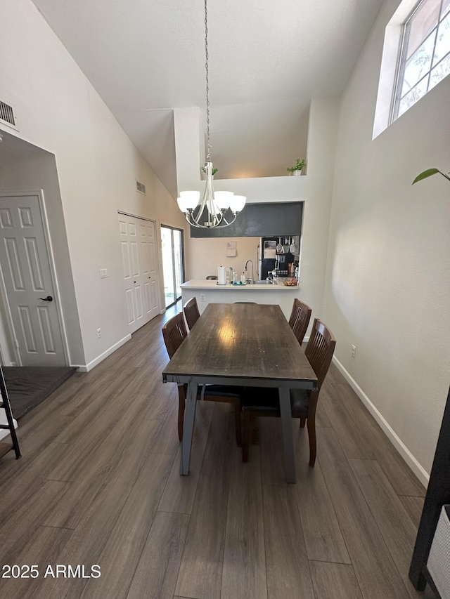 1718 S Longmore St Unit 53, Mesa, AZ 85202 - dining area with high vaulted ceiling, a chandelier, and dark wood-style flooring