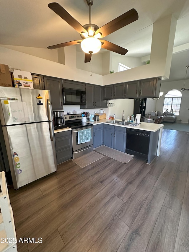 1718 S Longmore St Unit 53, Mesa, AZ 85202 - kitchen with black appliances, ceiling fan, high vaulted ceiling, light countertops, and dark wood-style flooring