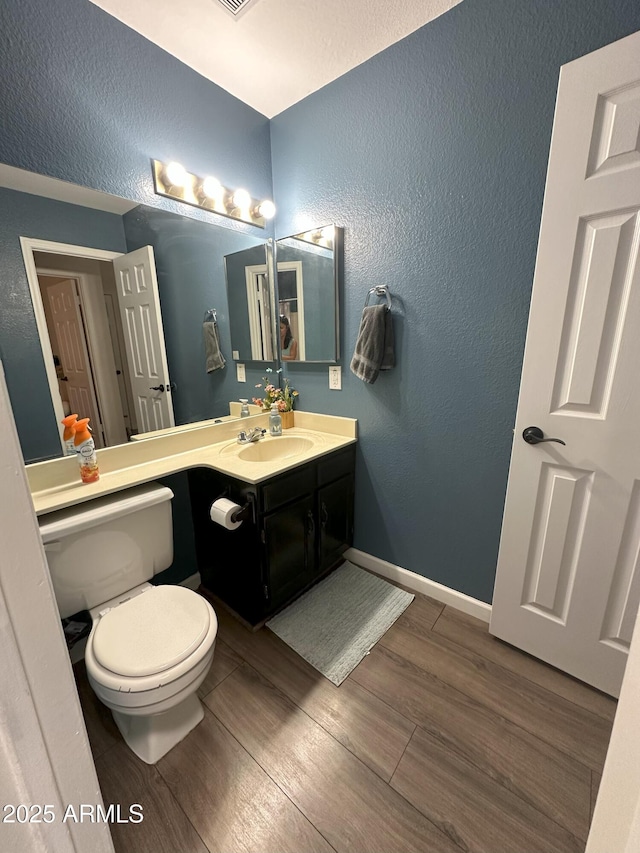 1718 S Longmore St Unit 53, Mesa, AZ 85202 - bathroom featuring a textured wall, wood finished floors, and vanity
