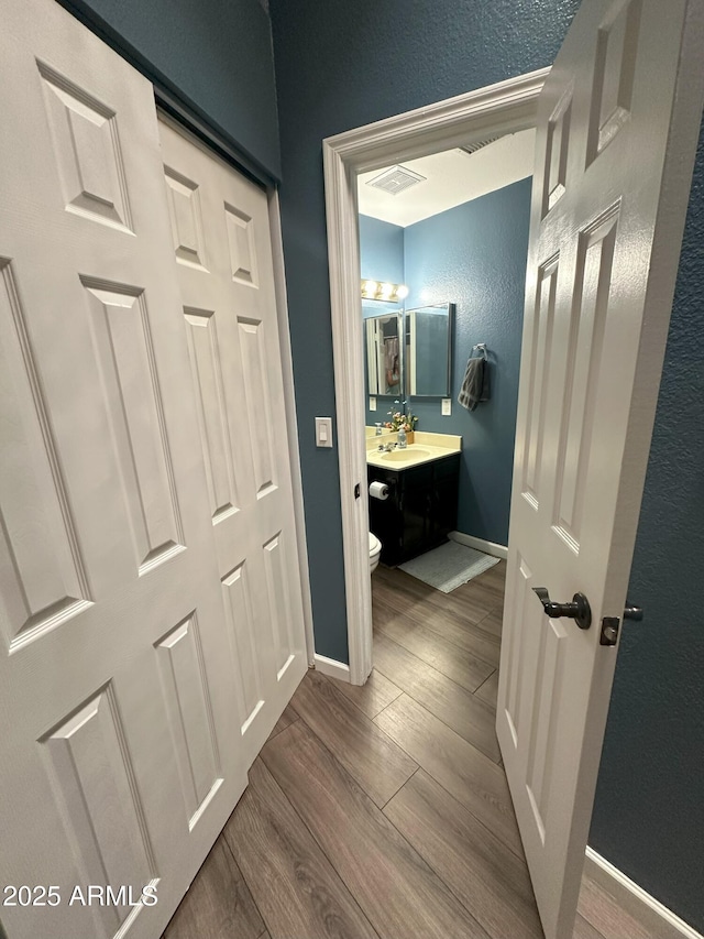 1718 S Longmore St Unit 53, Mesa, AZ 85202 - hall with dark wood-style floors and baseboards