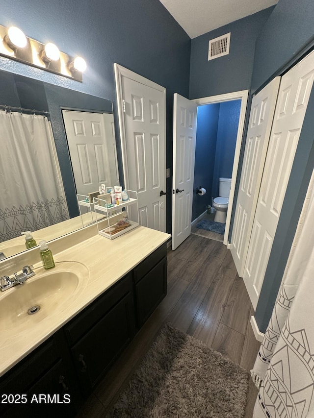 1718 S Longmore St Unit 53, Mesa, AZ 85202 - full bathroom featuring vanity and wood finished floors