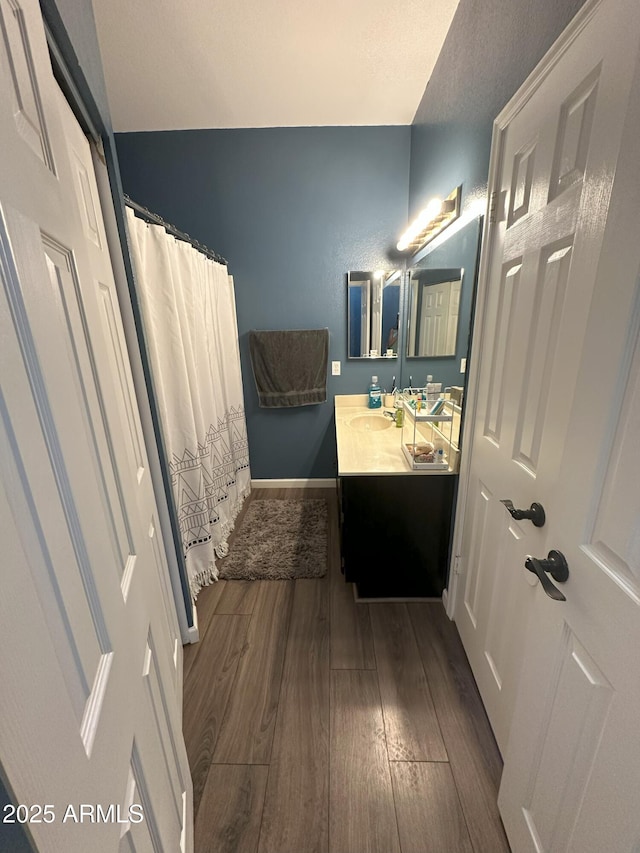 1718 S Longmore St Unit 53, Mesa, AZ 85202 - bathroom with wood finished floors, vanity, and a shower with curtain