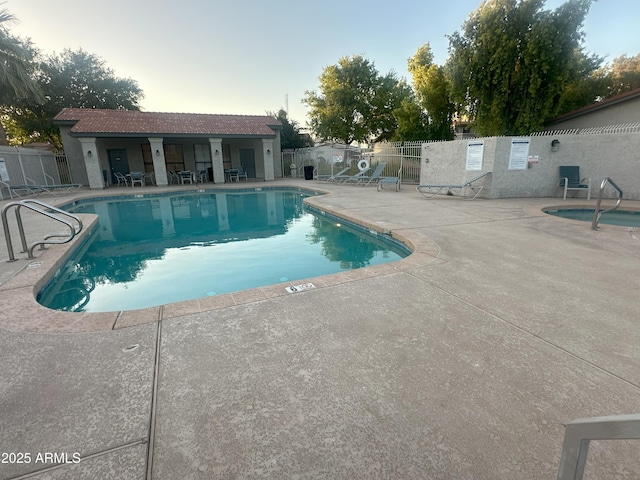 1718 S Longmore St Unit 53, Mesa, AZ 85202 - pool at dusk featuring a patio and a community pool