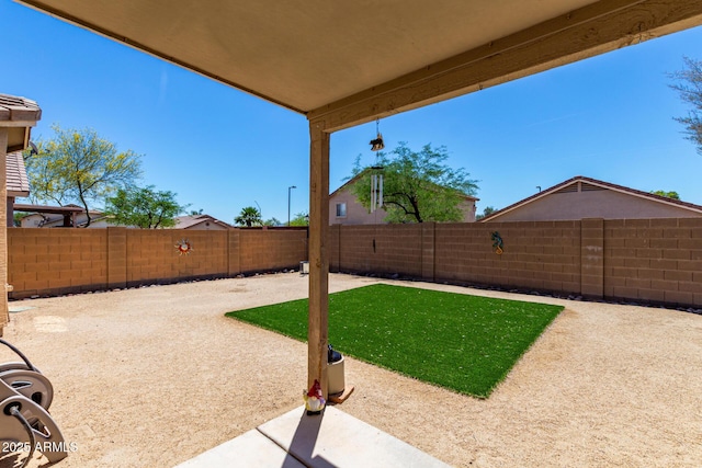 view of yard featuring a fenced backyard and a patio area