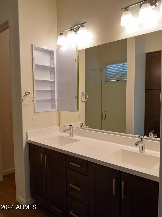 bathroom with hardwood / wood-style floors and vanity