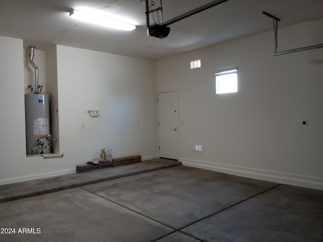 garage with a garage door opener and gas water heater