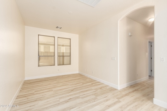 unfurnished room with light hardwood / wood-style flooring