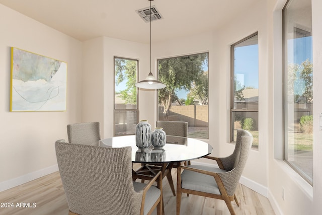 dining room with light wood-type flooring