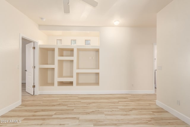 spare room with light hardwood / wood-style floors and ceiling fan