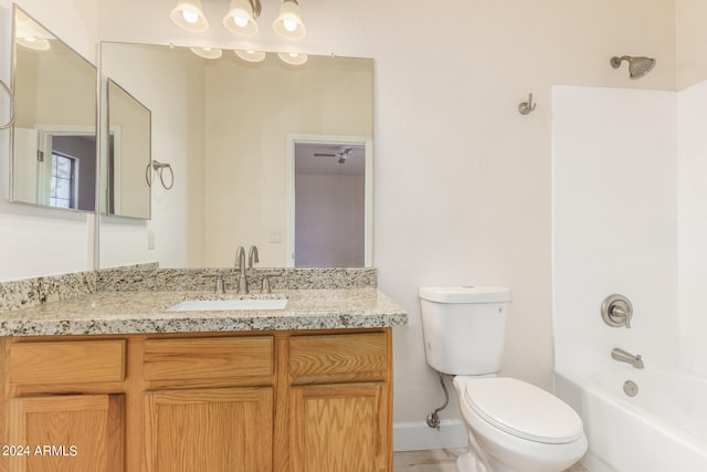 full bathroom with vanity, toilet, and  shower combination