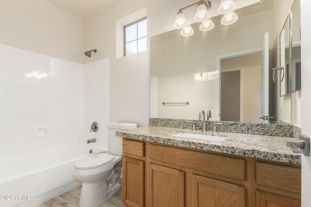 full bathroom featuring wood-type flooring, vanity, shower / bath combination, and toilet