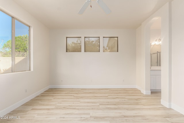 spare room featuring ceiling fan and light wood-type flooring