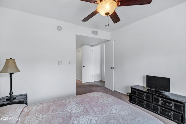 bedroom featuring ceiling fan and carpet