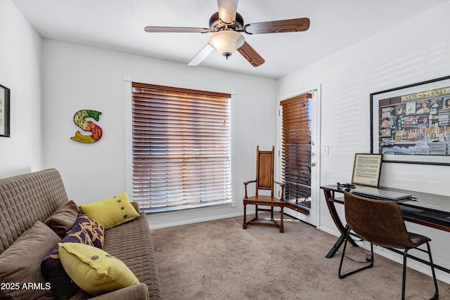 office featuring ceiling fan and light carpet