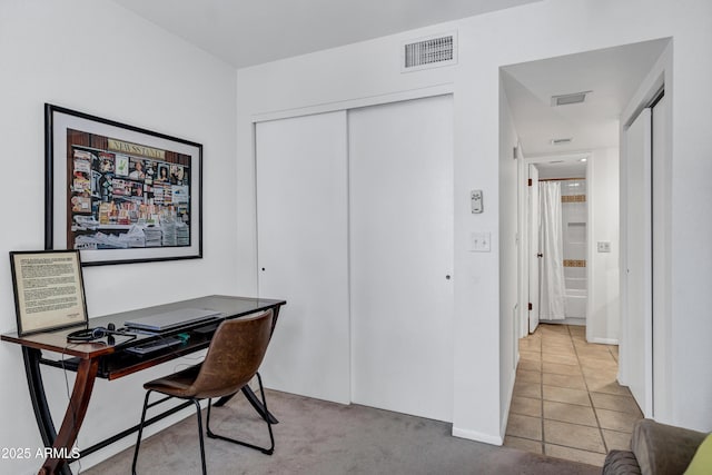 office space with light tile patterned floors