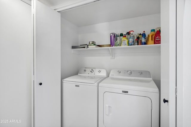 clothes washing area featuring independent washer and dryer