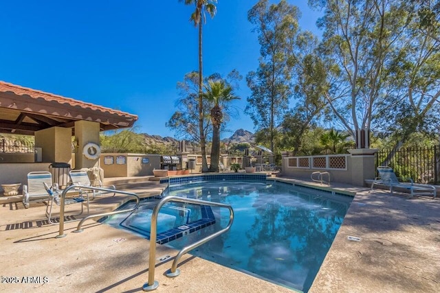 view of swimming pool featuring a patio area