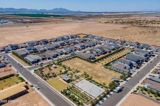 birds eye view of property with a mountain view