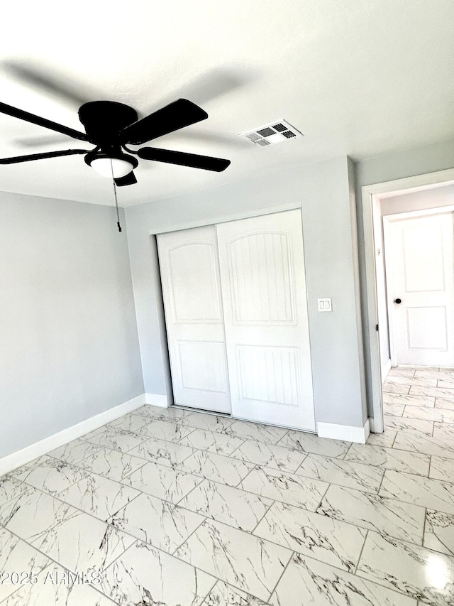 unfurnished bedroom with a closet and ceiling fan