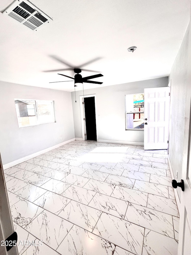 empty room featuring ceiling fan