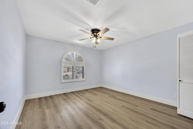 5728 E Sharon Dr, Scottsdale, AZ 85254 - spare room with ceiling fan, wood finished floors, and baseboards