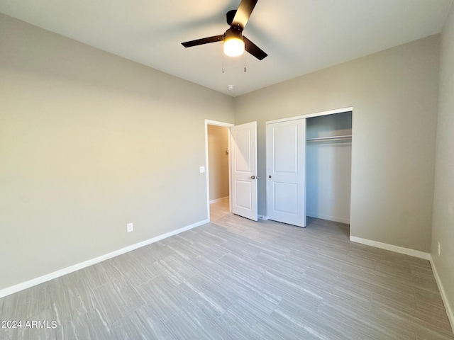 unfurnished bedroom featuring a closet, ceiling fan, and light wood-type flooring