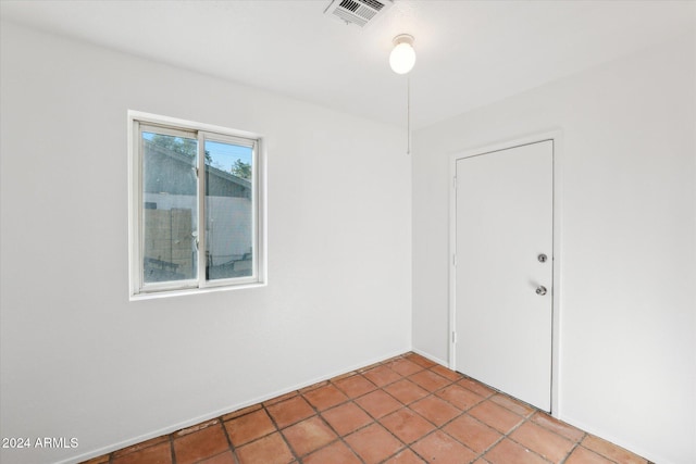 spare room with light tile patterned floors