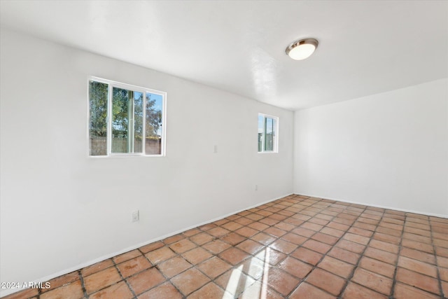 empty room with tile patterned flooring