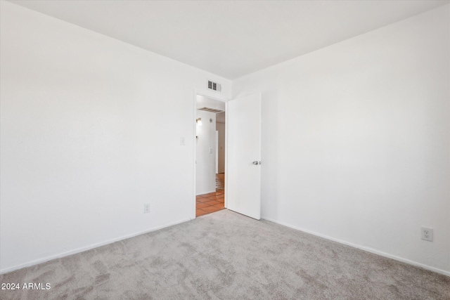 spare room with light colored carpet